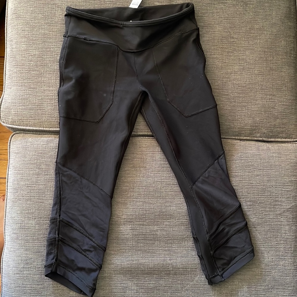 Black Iviva girls leggings. Crop length with net cuff/trim at bottom of leg
